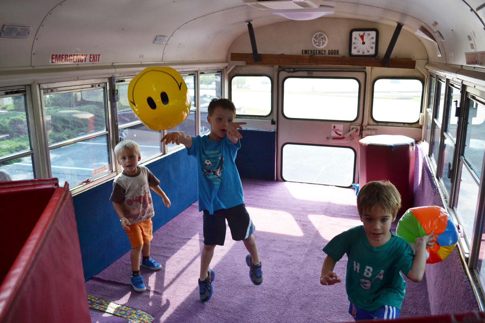 Children playing Vollyball on bus